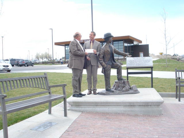 Con Paulos and Shawn Bariger donate to community