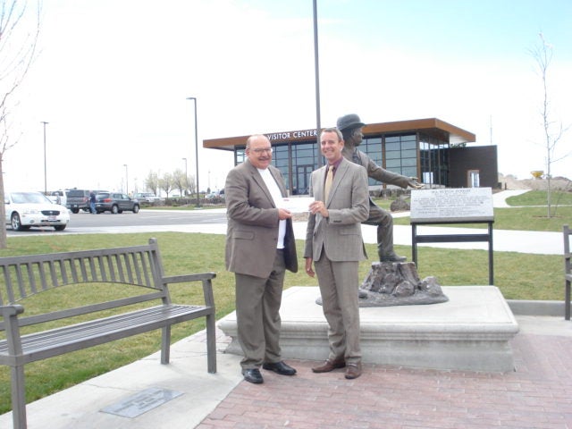 Con Paulos and Shawn Bariger donate to community